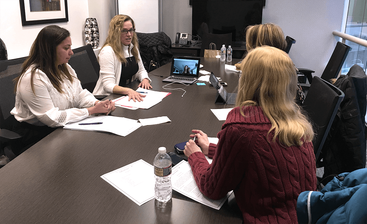 Four women having a business meeting.